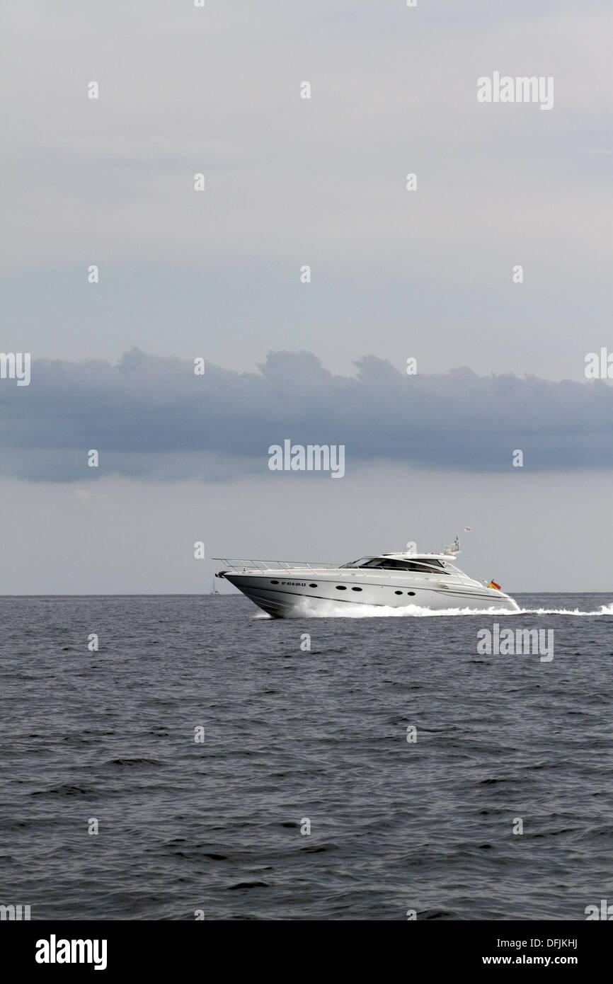 Motorboat speeding along in the med Stock Photo - Alamy