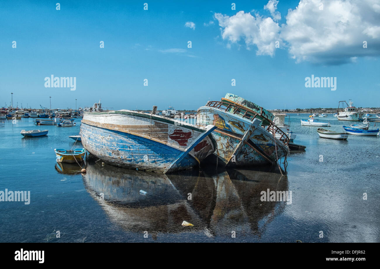 Two boats that had bought African migrants to Portopalo di C Passero, Sicily Stock Photo