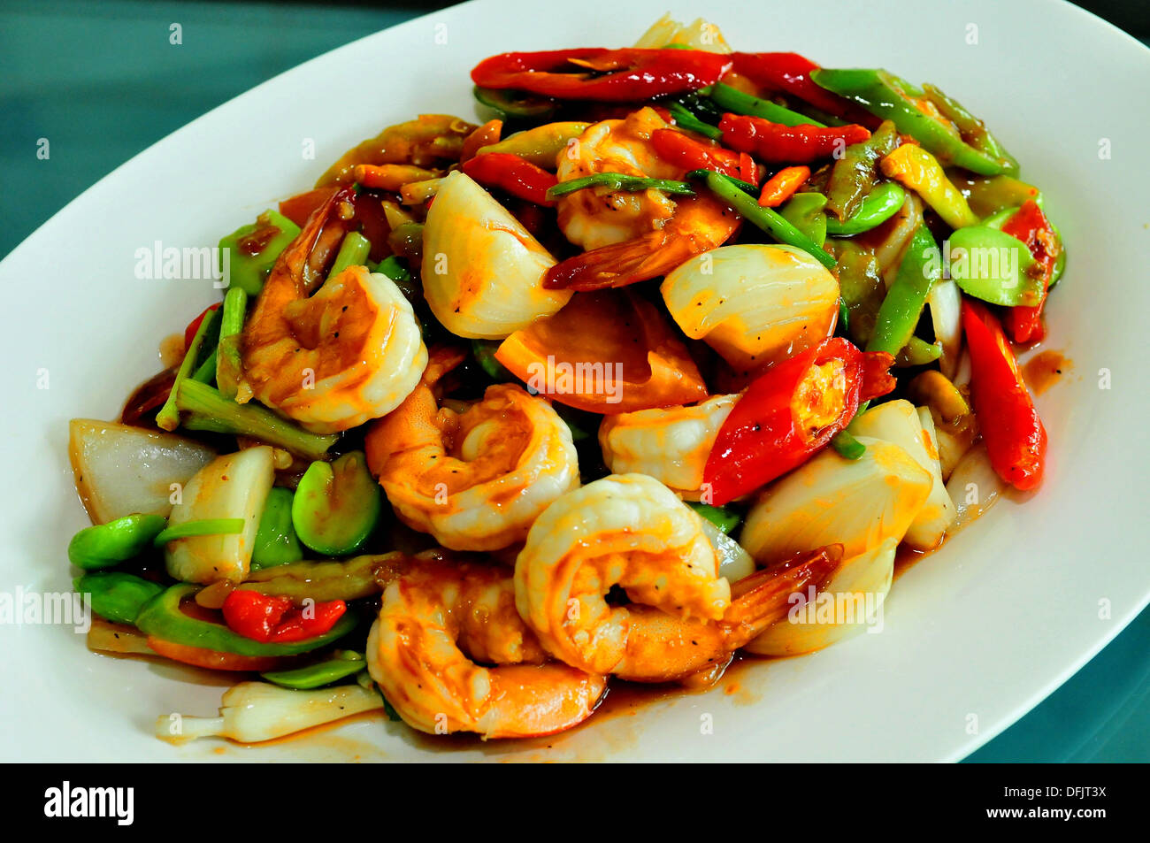 Taste of Thailand - Stinky beans stir fried in red curry paste with shrimp Stock Photo
