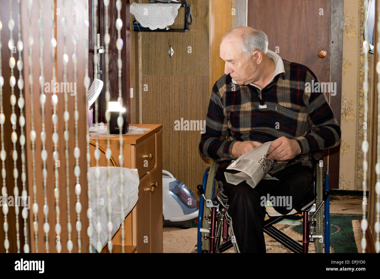 Old man wheelchair thinking hi-res stock photography and images - Alamy