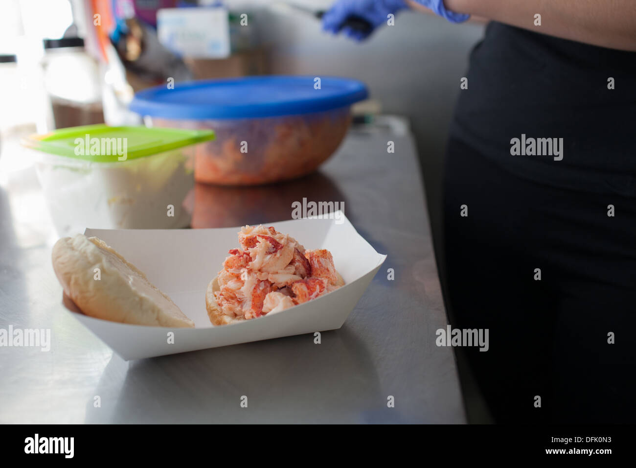 Kelly Skanes prepares a lobster roll at Chauncey Creek Lobster Pier. Stock Photo