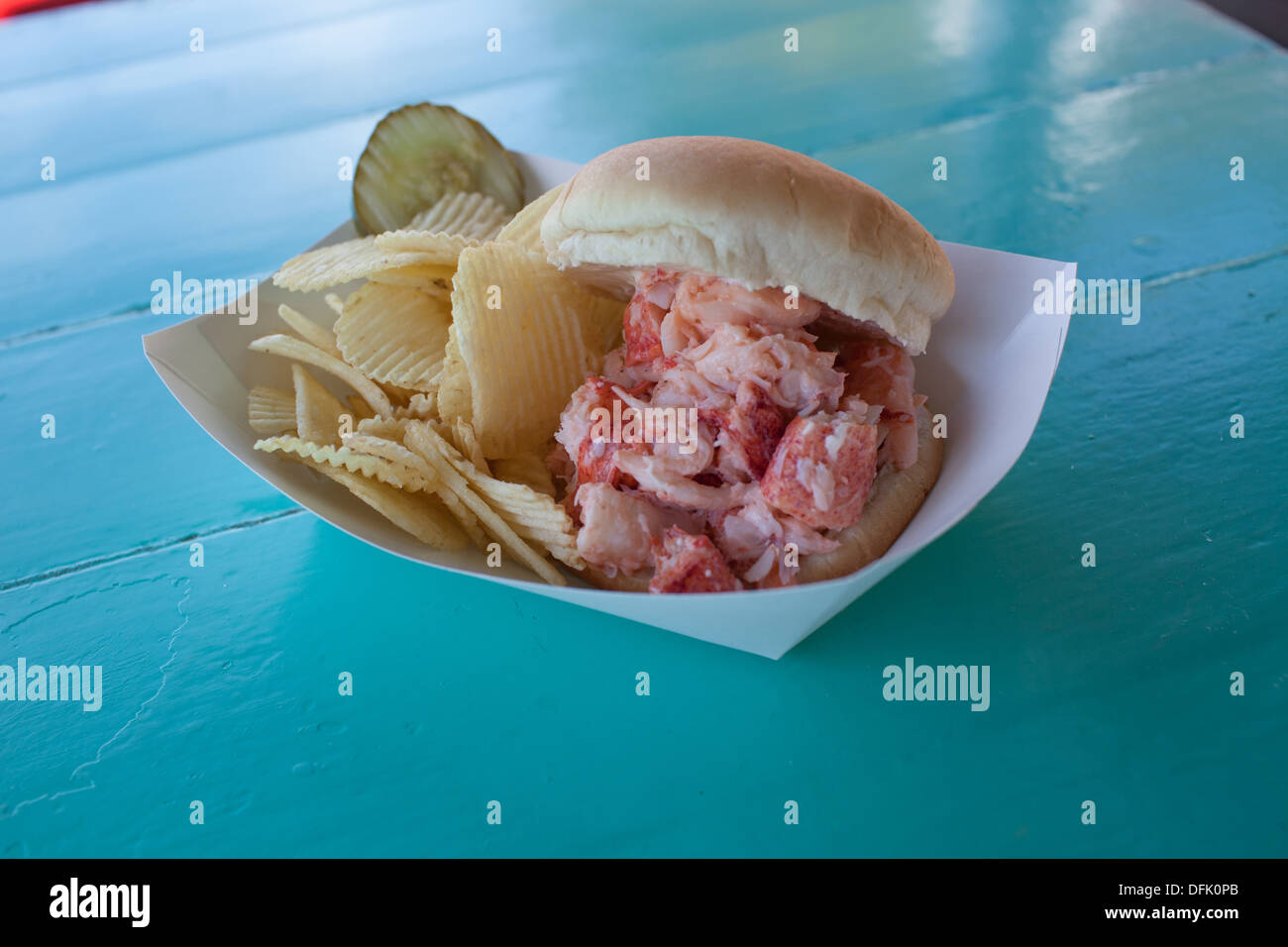Chauncey Creek Lobster Pier Lobster Roll on a picnic table Stock Photo