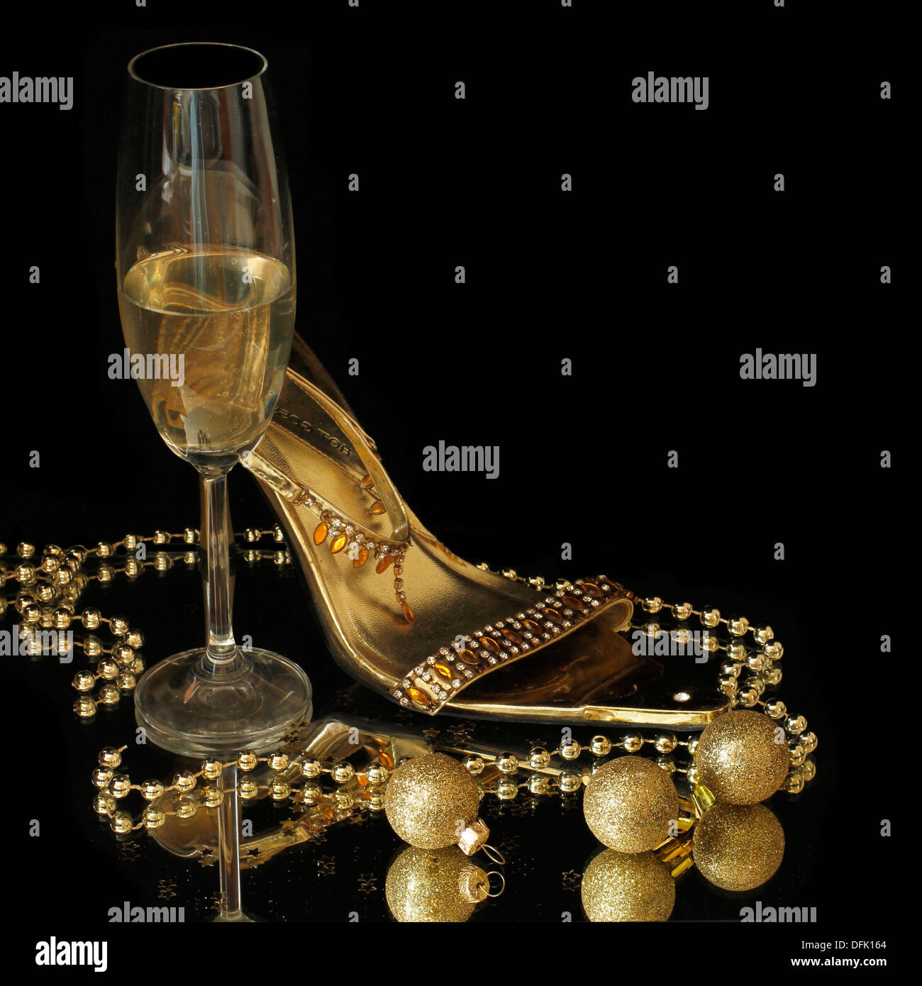 gold party shoes with champagne glasses Stock Photo - Alamy