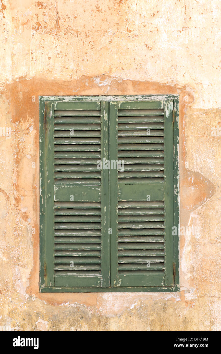Green shuttered window, closed Stock Photo