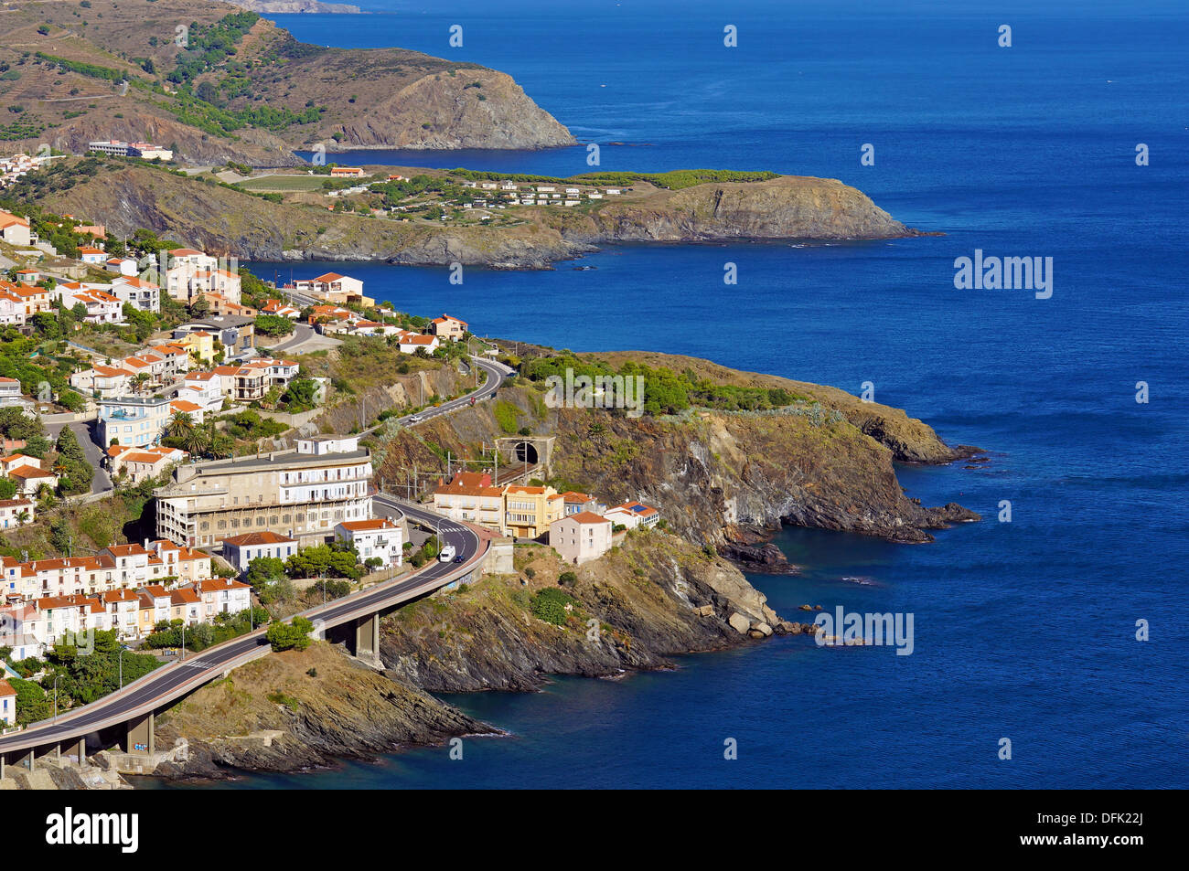 Rocky coast in the Pyrenees Orientales with the village of Cerbere, Vermilion coast, Mediterranean sea, Roussillon, France Stock Photo