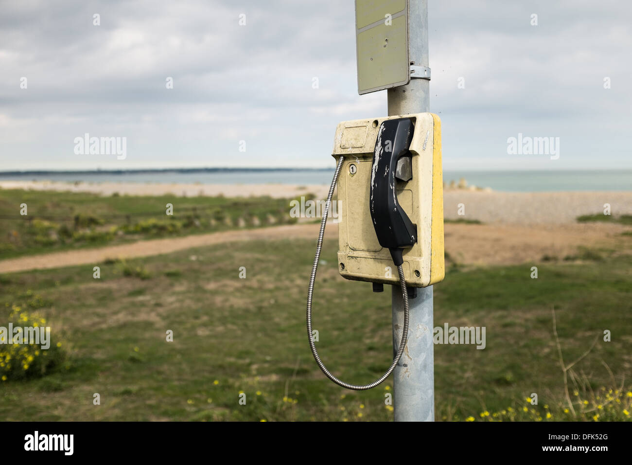 An Isolated Phone on a Pole by the Beach. Stock Photo