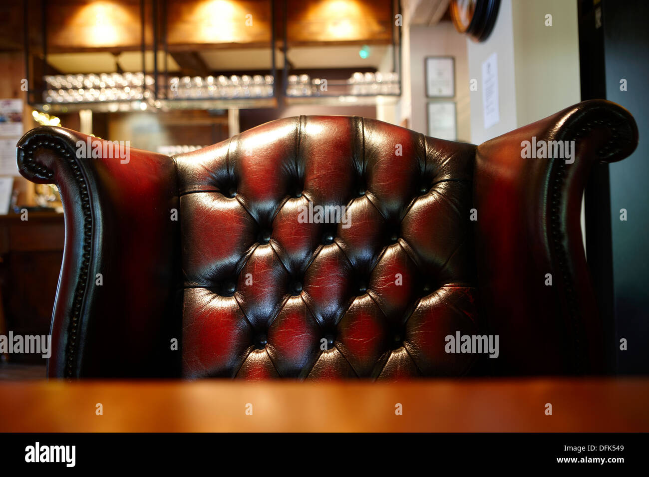 Dark brown leather wing back chair Stock Photo Alamy