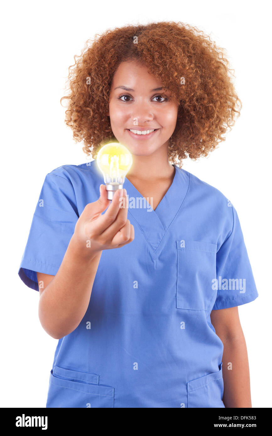 African American nurse holding a light bulb, isolated on white background - Black people Stock Photo