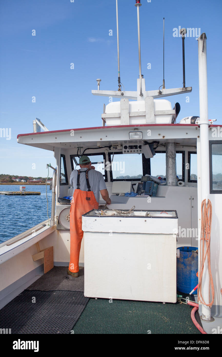 Lobsterman Eric Emmons drives his Maine lobster boat out Stock Photo