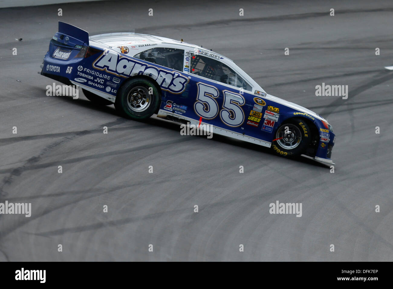 Kansas City, KS, USA. 6th Oct, 2013. October 06, 2013: Mark Martin, driver of the #55 Aaron's Dream Machine Toyota, slams into the wall during the Nascar Sprint Cup Hollywood Casino 400 at Kansas Speedway in Kansas City, KS. Credit:  csm/Alamy Live News Stock Photo