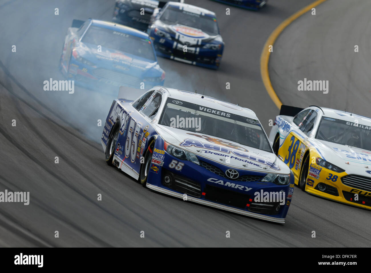 Kansas City, KS, USA. 6th Oct, 2013. October 06, 2013: Smokes come out of the car of Mark Martin, driver of the #55 Aaron's Dream Machine Toyota, during the Nascar Sprint Cup Hollywood Casino 400 at Kansas Speedway in Kansas City, KS. Credit:  csm/Alamy Live News Stock Photo