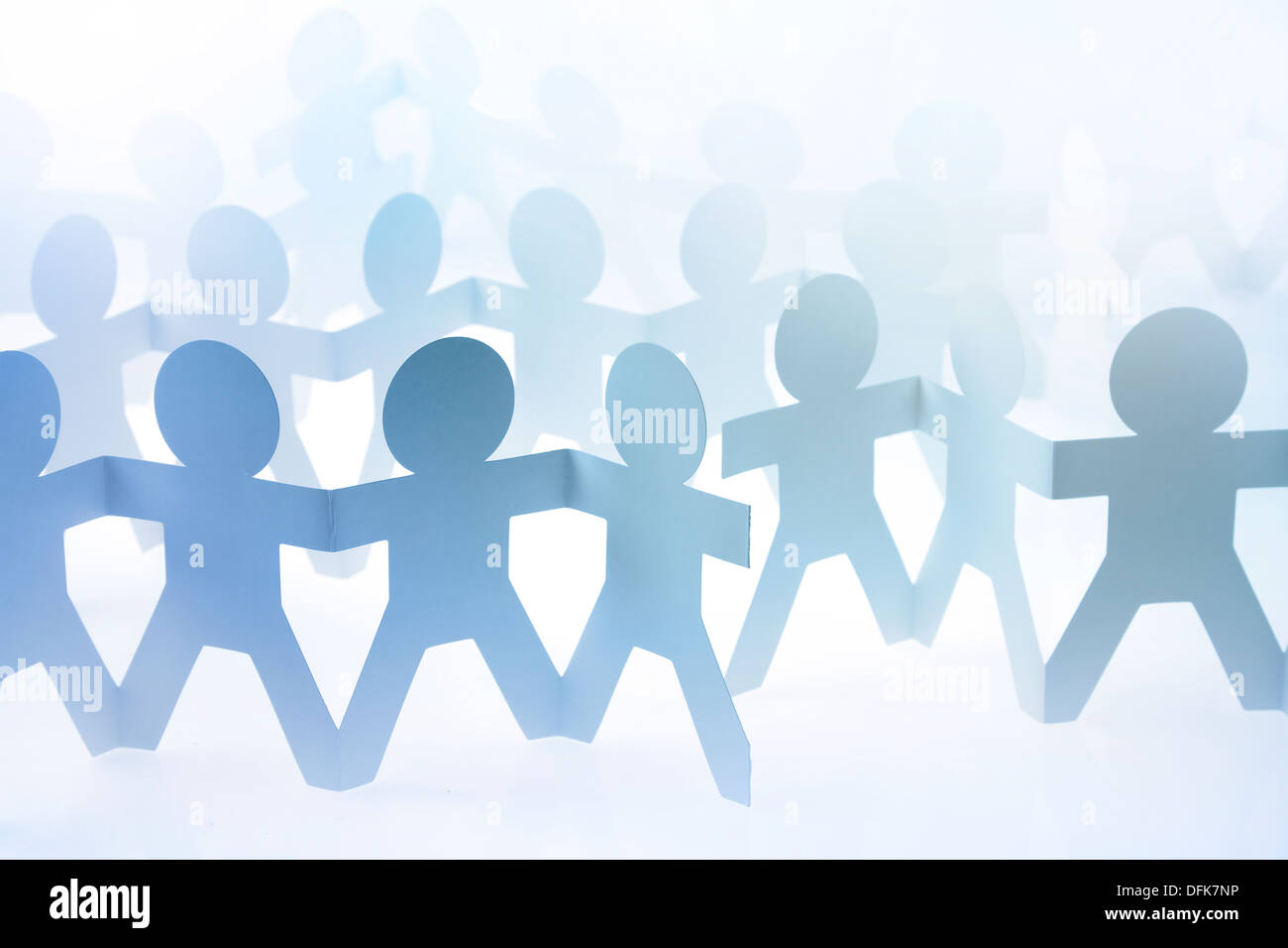 Paper dolls holding hands hires stock photography and images Alamy