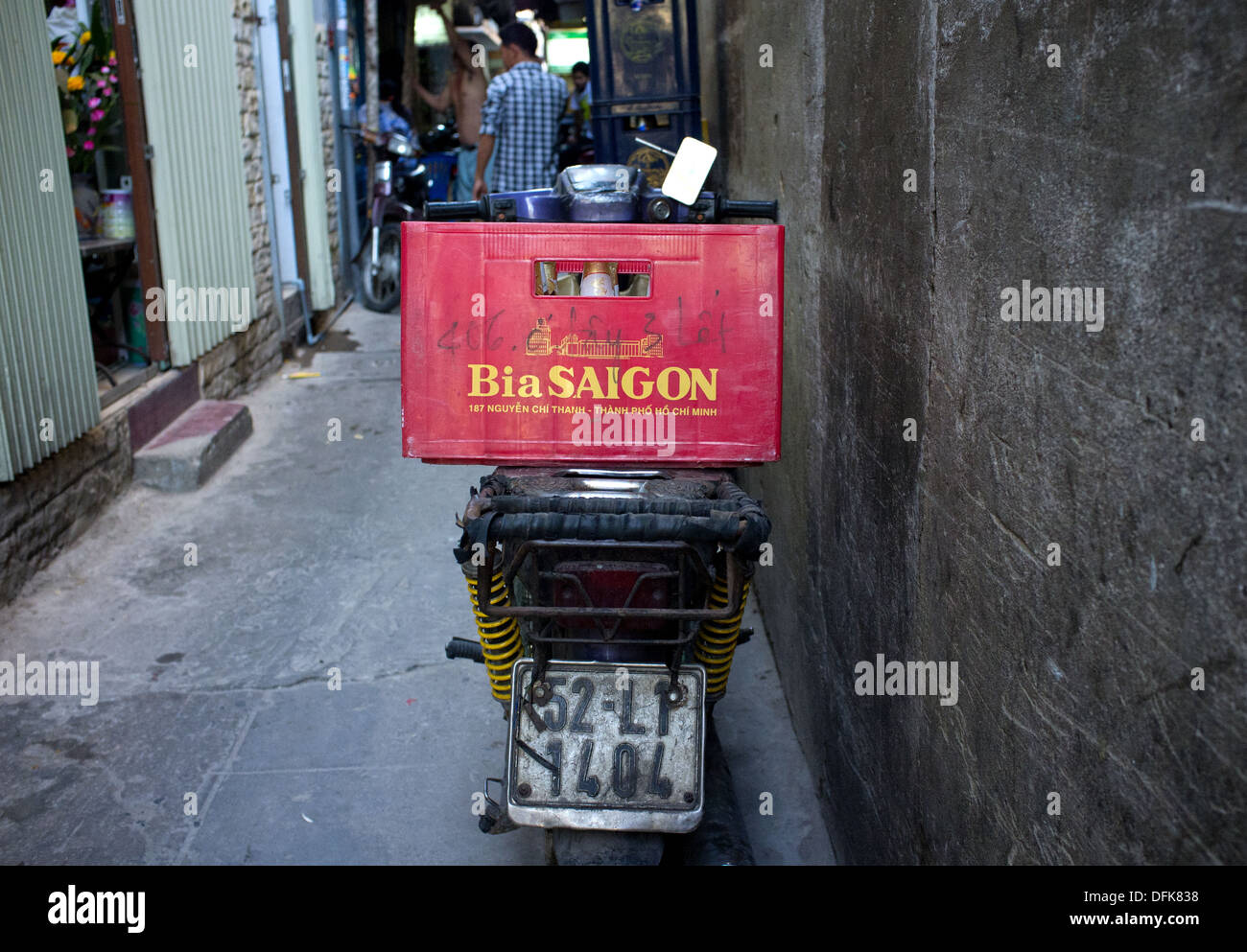 Bia Saigon (Saigon beer) crate on the back of a motorbike parked in an alley in Saigon, Vietnam Stock Photo