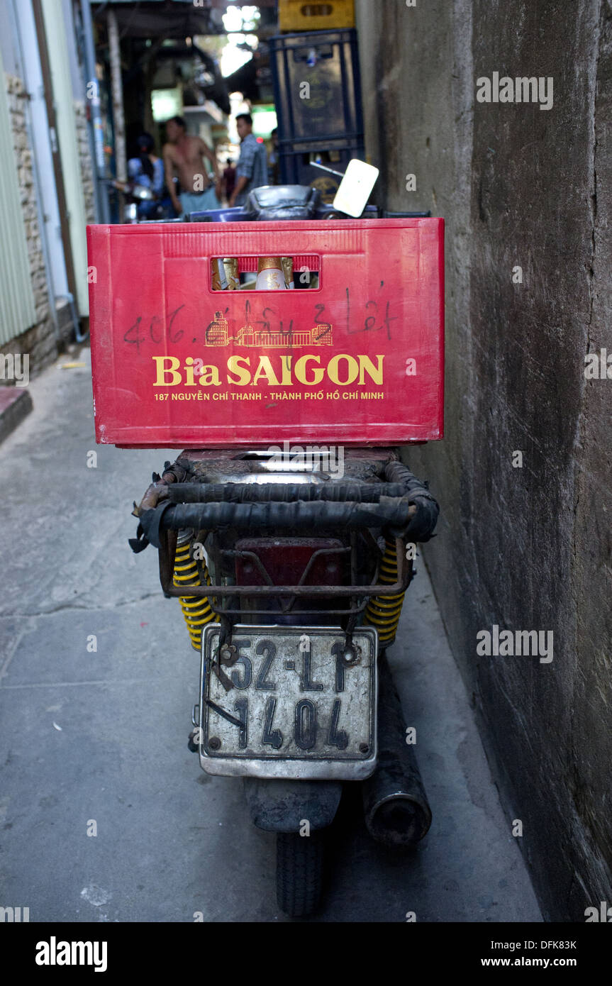 Bia Saigon (Saigon beer) crate on the back of a motorbike parked in an alley in Saigon, Vietnam Stock Photo
