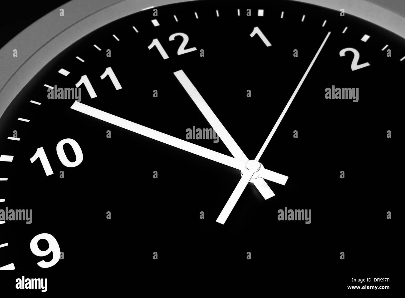 Closeup of hands on clock face Stock Photo