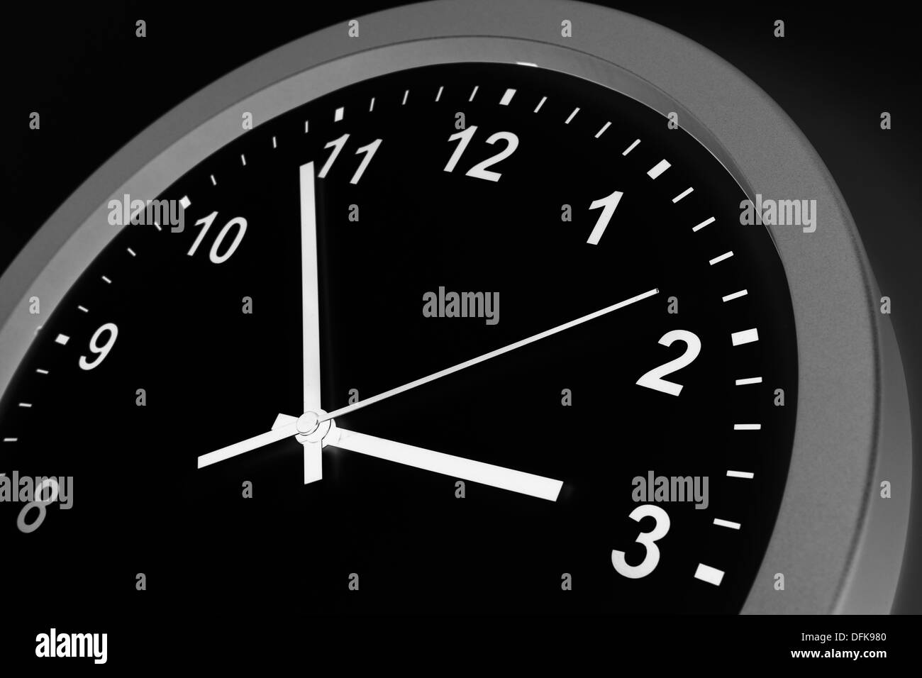 Closeup of hands on clock face Stock Photo