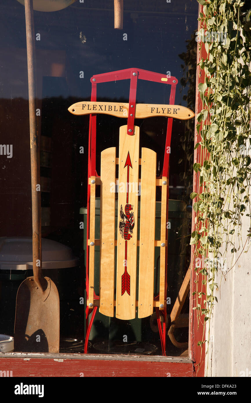 Flexible Flyer sled displayed in a window, New Hampshire, USA Stock Photo