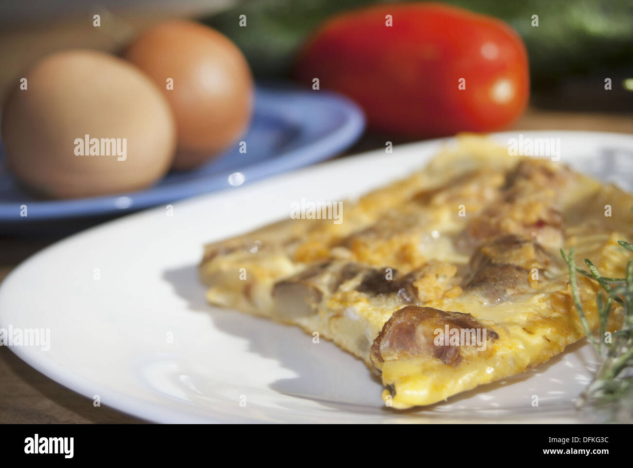 a traditional italian dish: omelette with sausage Stock Photo
