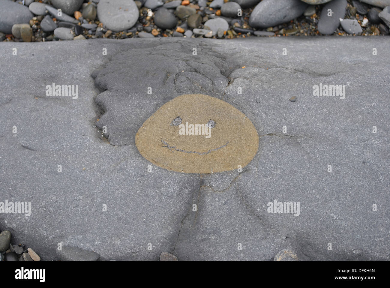 A natural rock formation that lent itself to a smiley face Stock Photo