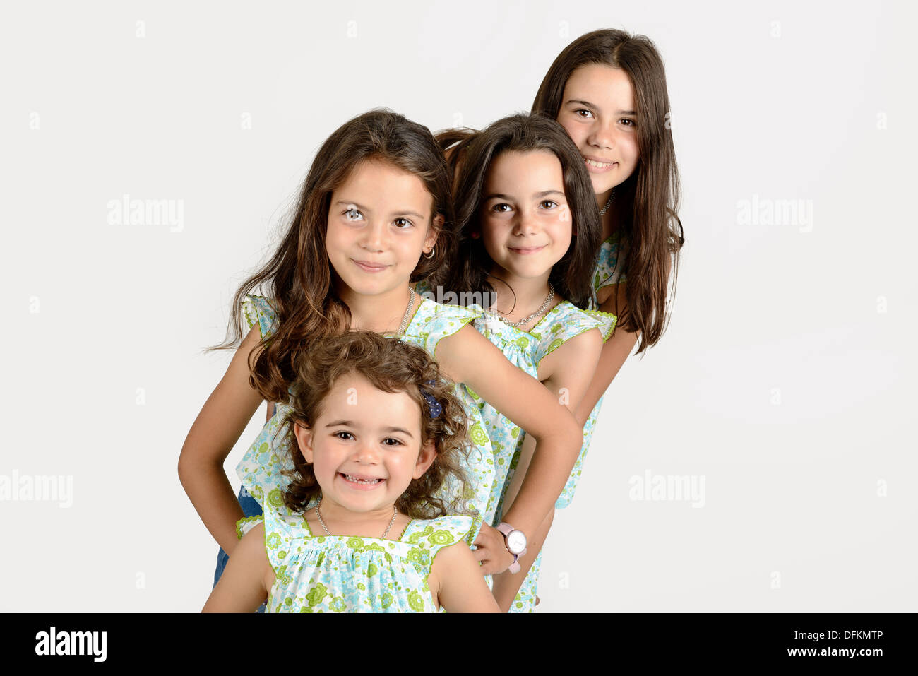 Group of young girls posing isolated Stock Photo - Alamy