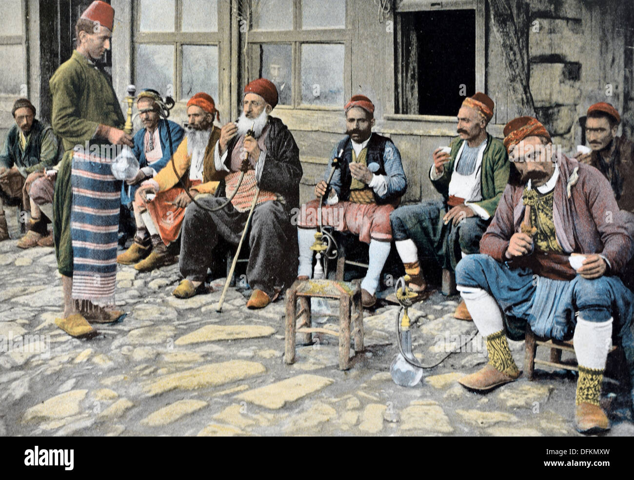 Turkish Ottoman Men Smoking Waterpipes or Narghiles Outside a Cafe or Coffee Shop Istanbul or Constantinople Turkey Stock Photo