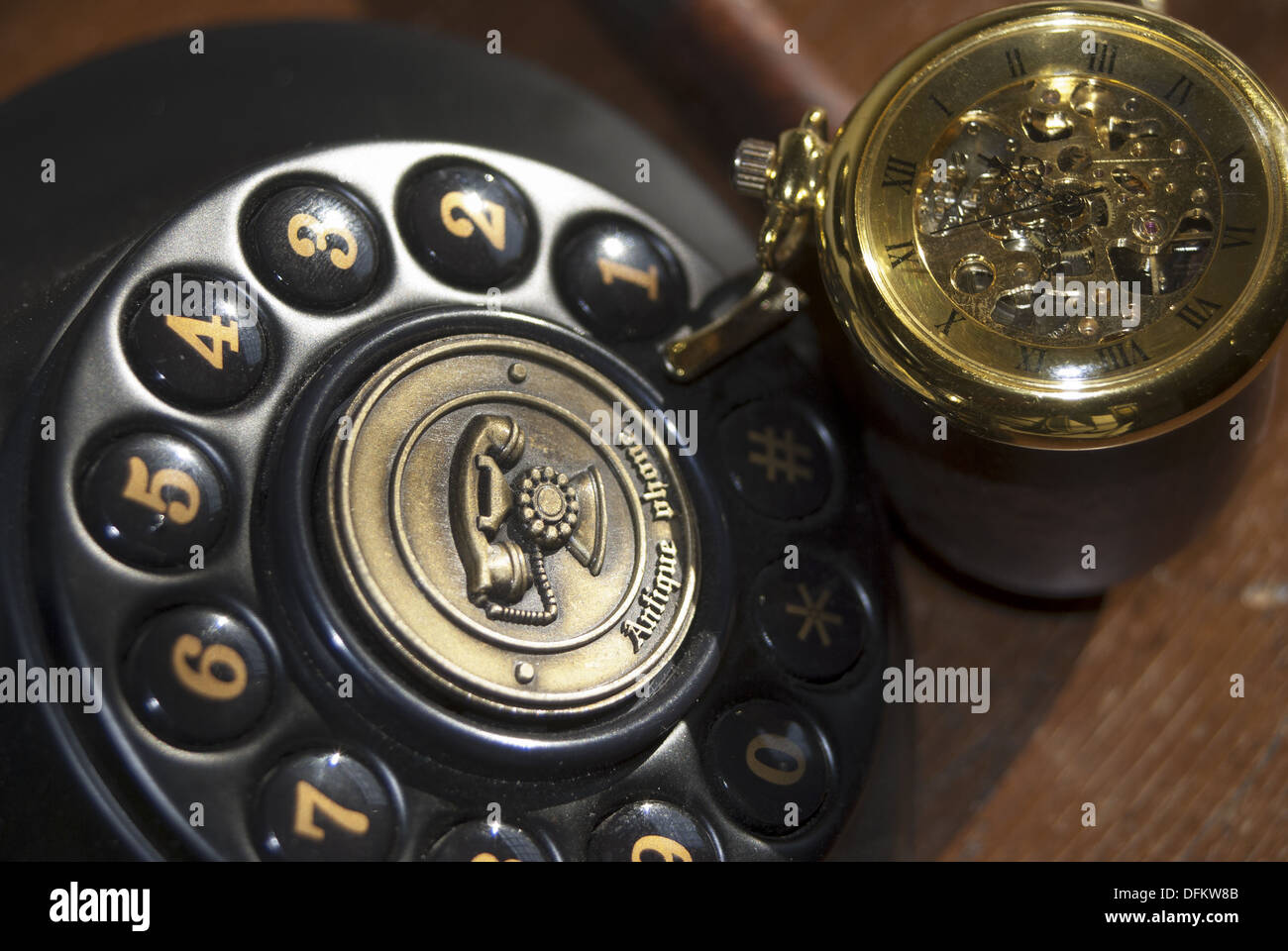 Vintage: some old objects. An old watch and a telephone Stock Photo