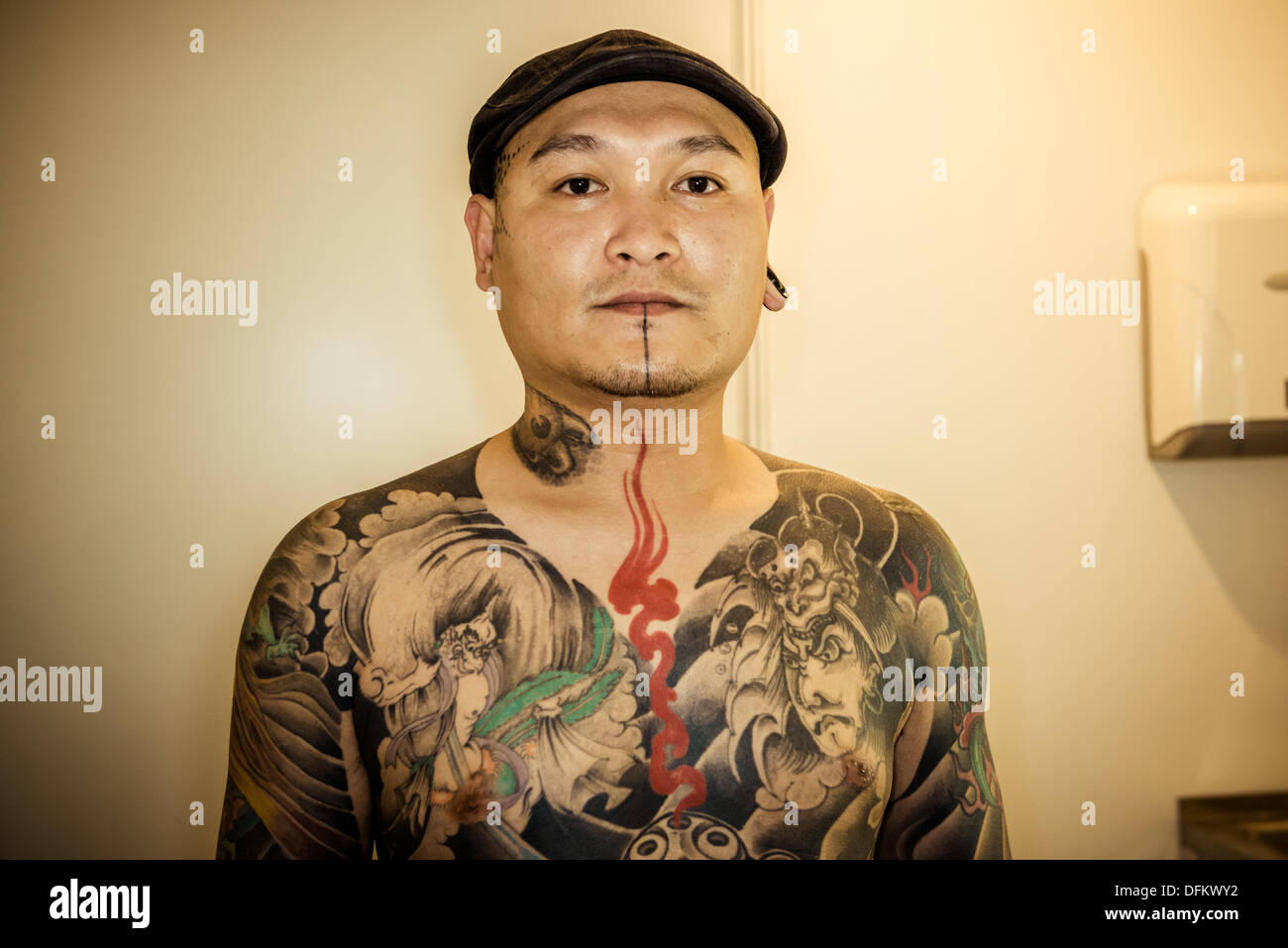 Barcelona, Spain. 6th Oct, 2013: Tattoo artist Hua from East Tattoo Taiwan poses for a photo at the 16th International Barcelona Tattoo Expo. Credit:  matthi/Alamy Live News Stock Photo
