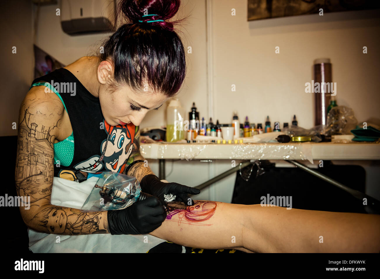 Professional Artist Doing Tattoo on Client Arm Editorial Stock Photo   Image of 17th event 51060988