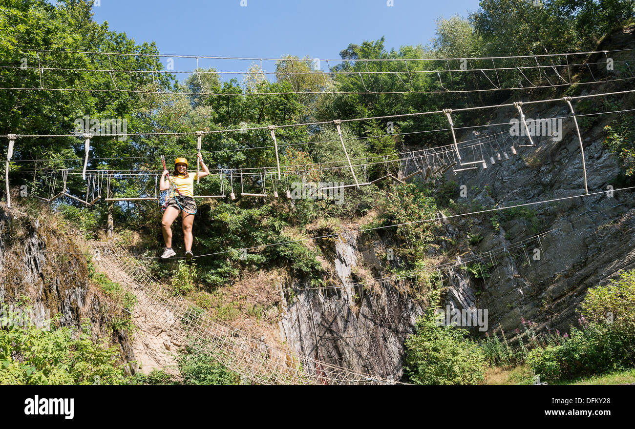 Woman Crossing Rope Ravine crossing hi-res stock photography and images - Alamy