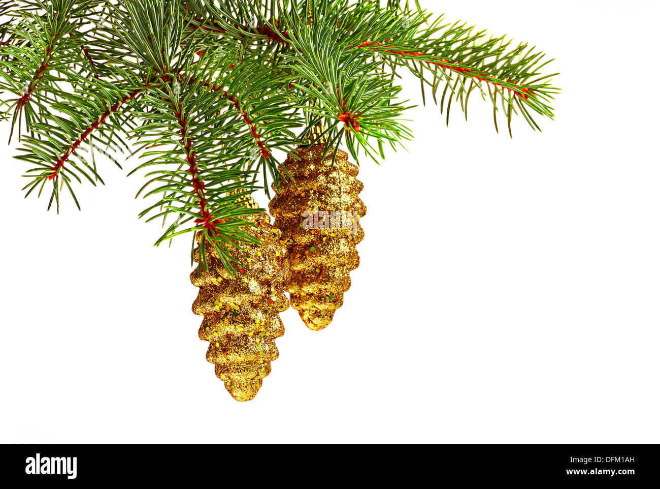 Christmas decoration. Golden toy fir cones and Christmas tree Stock Photo