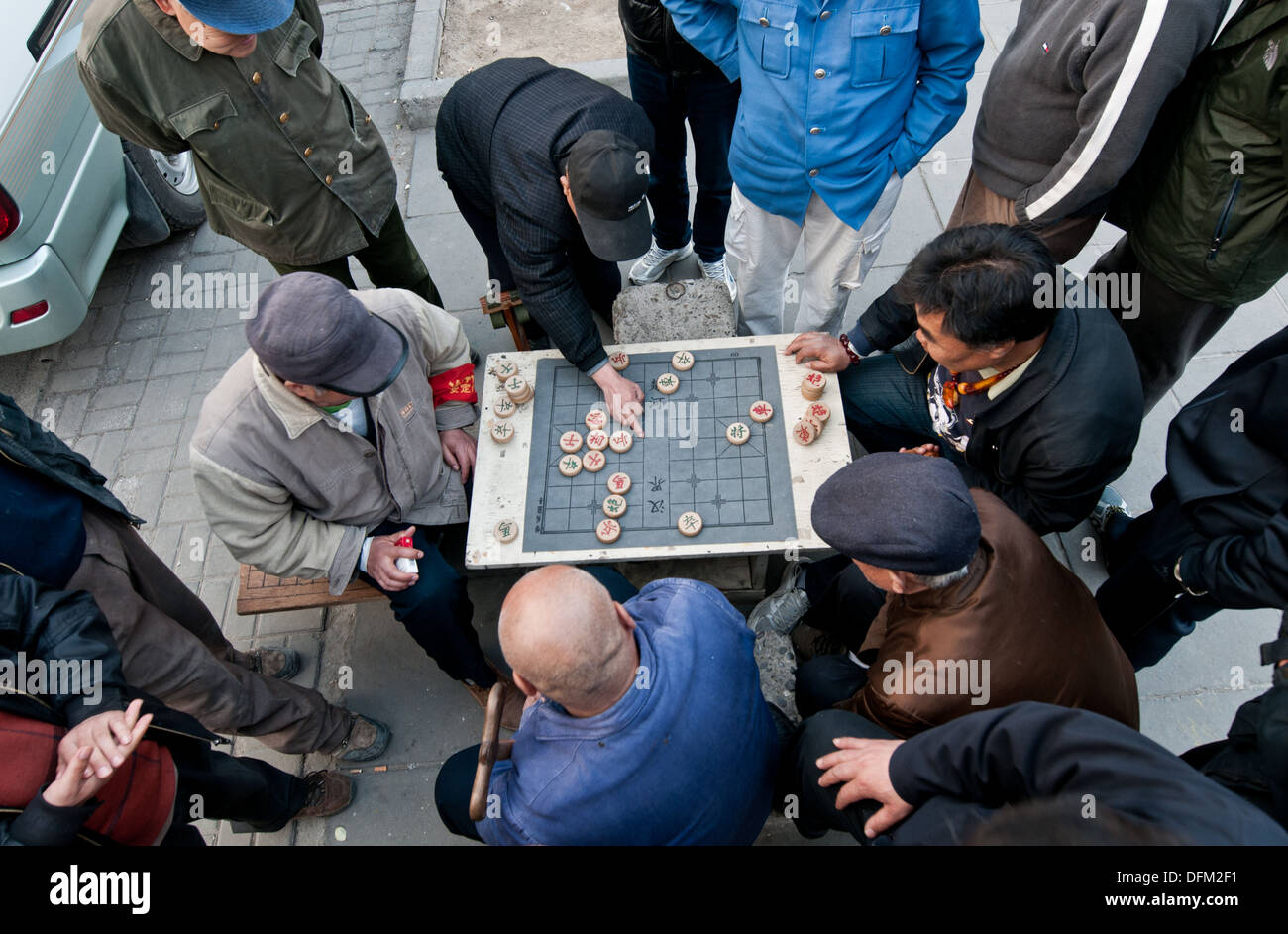 Chinese men playing Xiangqi also called Chinese chess in Beijing, China Stock Photo