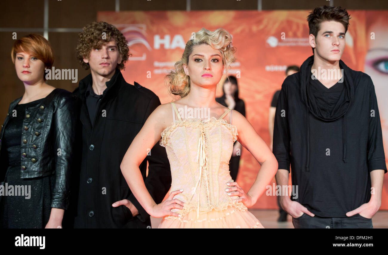 Nuremberg, Germany. 07th Oct, 2013. Models (L-R) Sonia, Lukas, Hilal and  Johannes present 2013 fall/winter hairstyle trends ahead of the Bavarian  championship and trade fair Hair, Beauty and more '2013 Hair' in, image size:1300x856