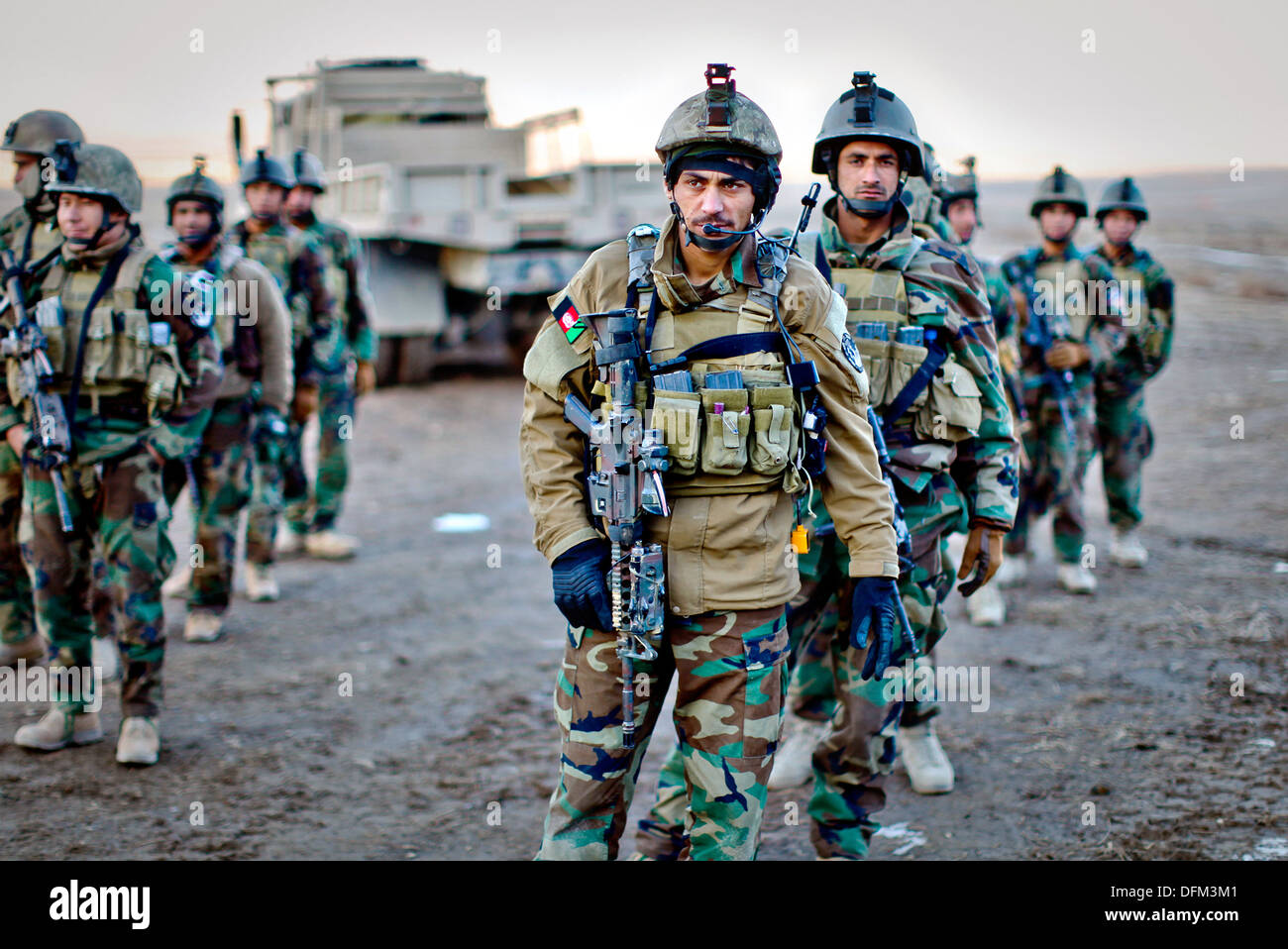 Afghan National Security Forces soldiers stand in formation combat ready as they are briefed for live-fire drills December 22, 2012 in Kabul, Afghanistan. Stock Photo