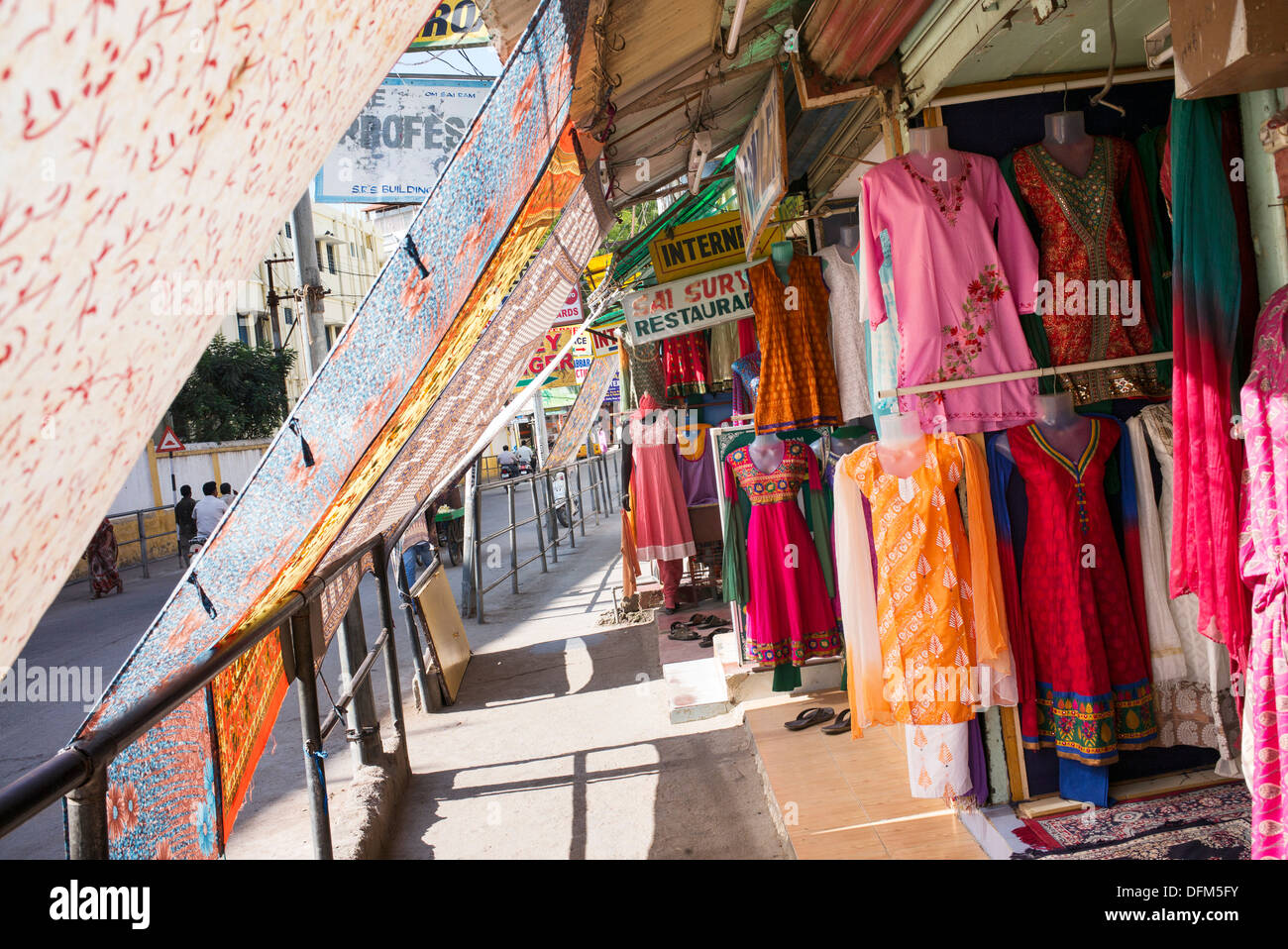 Puttaparthi high street shops protected from the sun by sheets. Andhra Pradesh, India Stock Photo