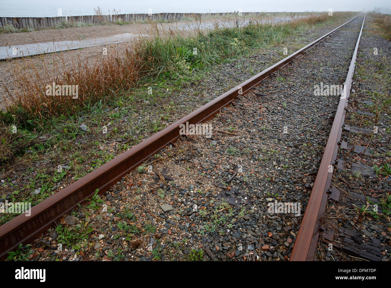 Rusted railway receding into the distance, Gaspé Peninsula, Québec, Canada Stock Photo