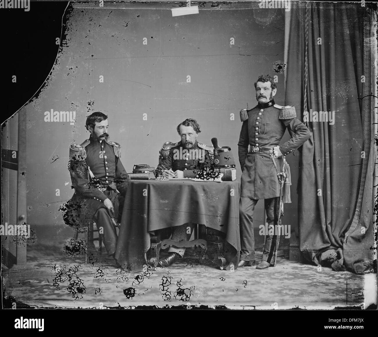 This photograph depicts officers in state uniforms, likely military or ...