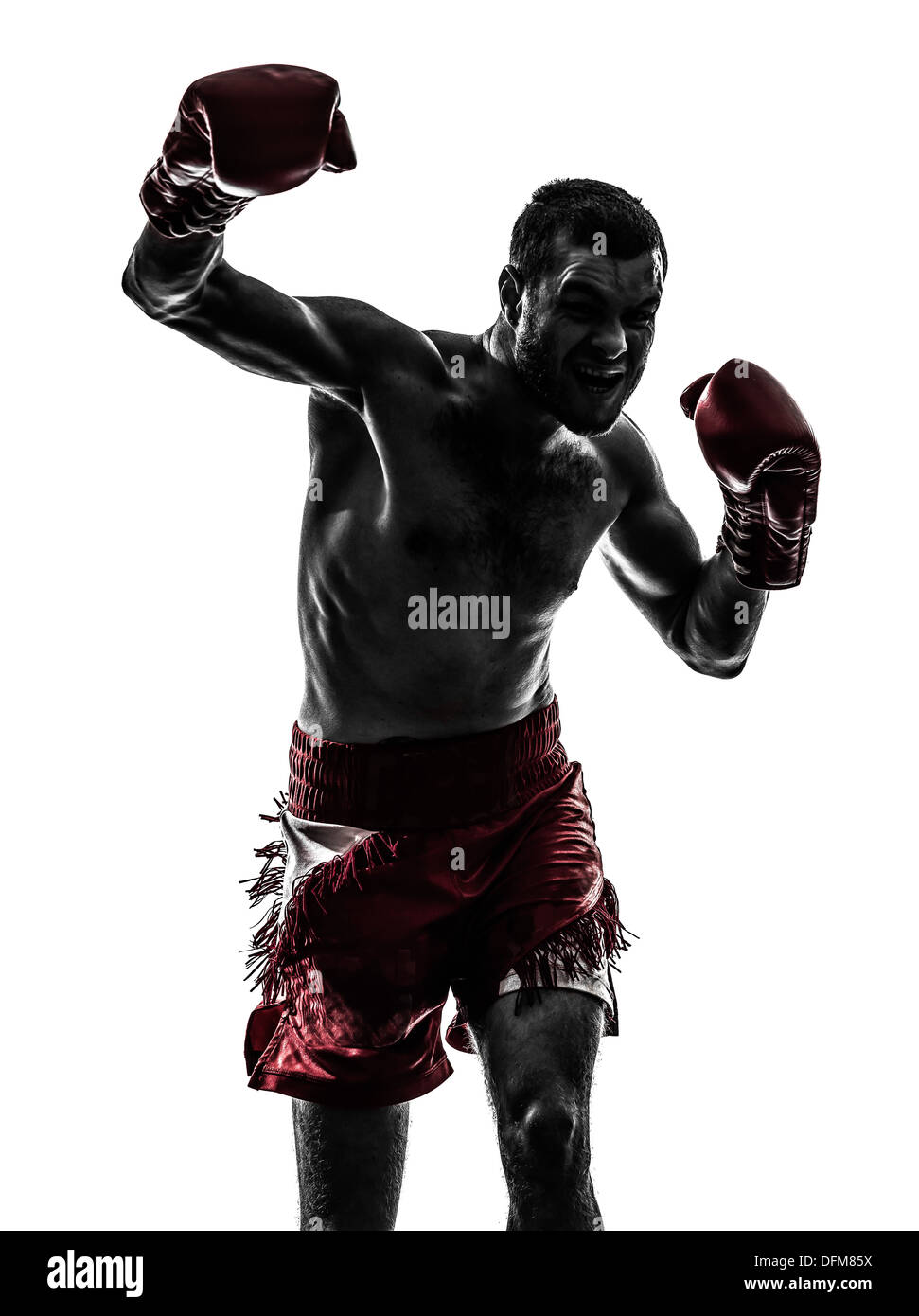 one  man exercising thai boxing in silhouette studio on white background Stock Photo