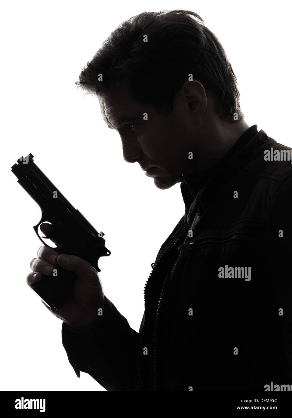 one man killer policeman holding gun portrait silhouette studio white background Stock Photo
