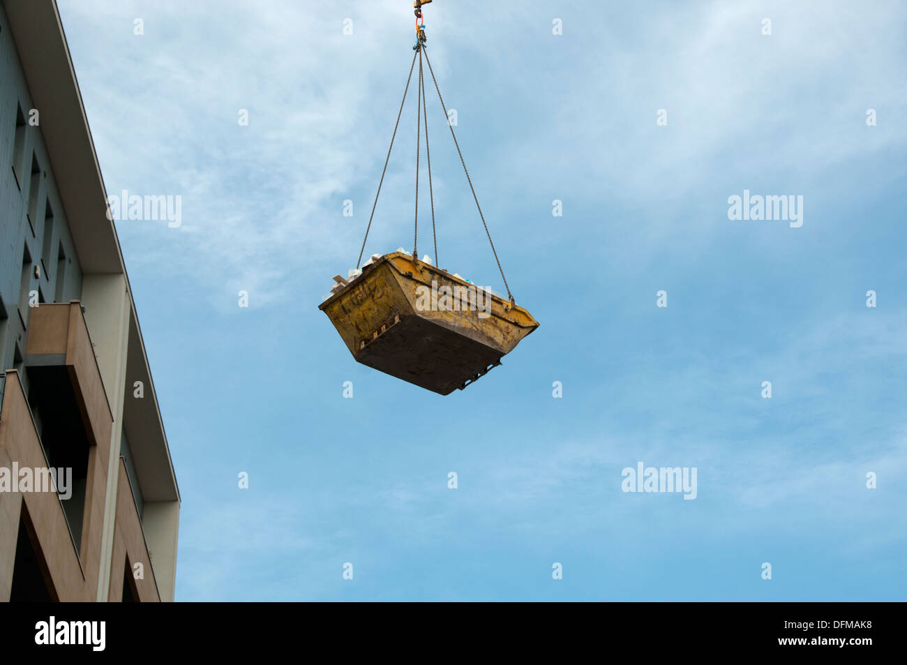 Hackney, London 2013. Construction site skip removing rubbish Stock