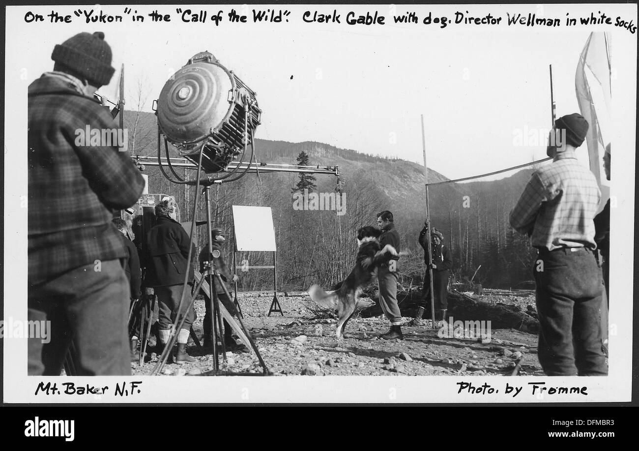 Clark Gable, with his dog, is pictured in the Mount Baker National Forest in 1935, during a scene from *The Call of the Wild*. The image reflects both Hollywood’s portrayal of adventure and the rugged beauty of the Pacific Northwest. Stock Photo