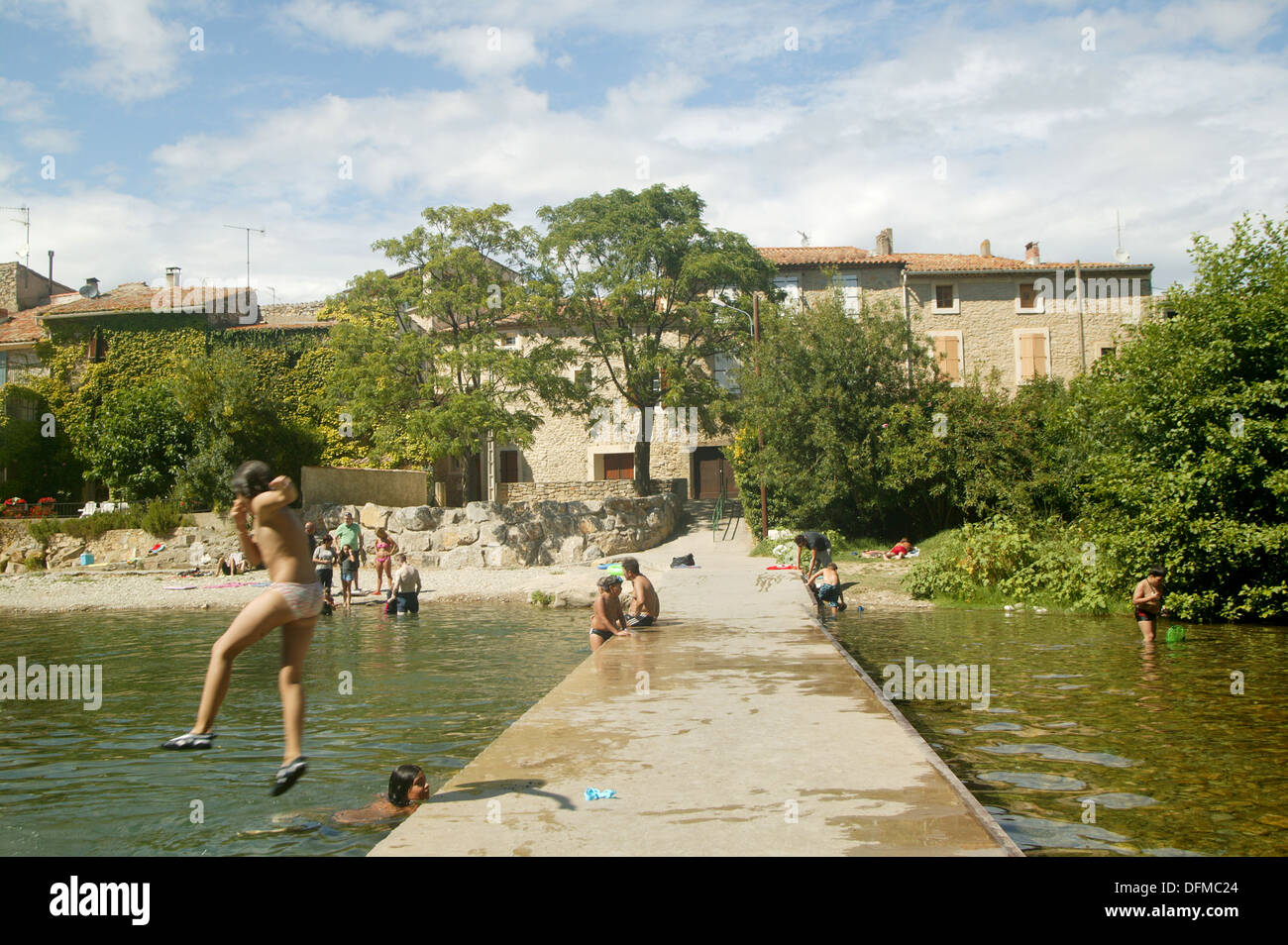 a hot summer day in rural France. a typical day in the life of a European child playing in the local river Stock Photo