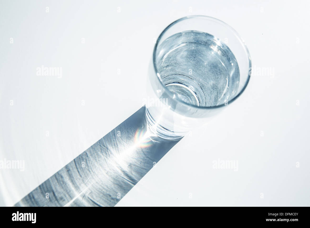 Caustic effect as light passes through a glass of water Stock Photo Alamy