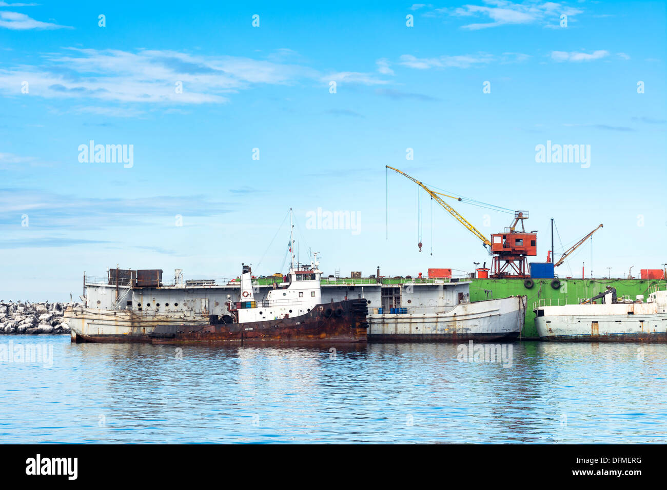 A dry dock ship repair yard in Ensenada Mexico showing two old, work