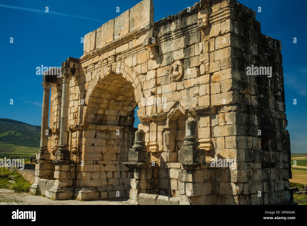 Triumphal Arch in the Roman settlement of Volubilis in Morocco Stock Photo