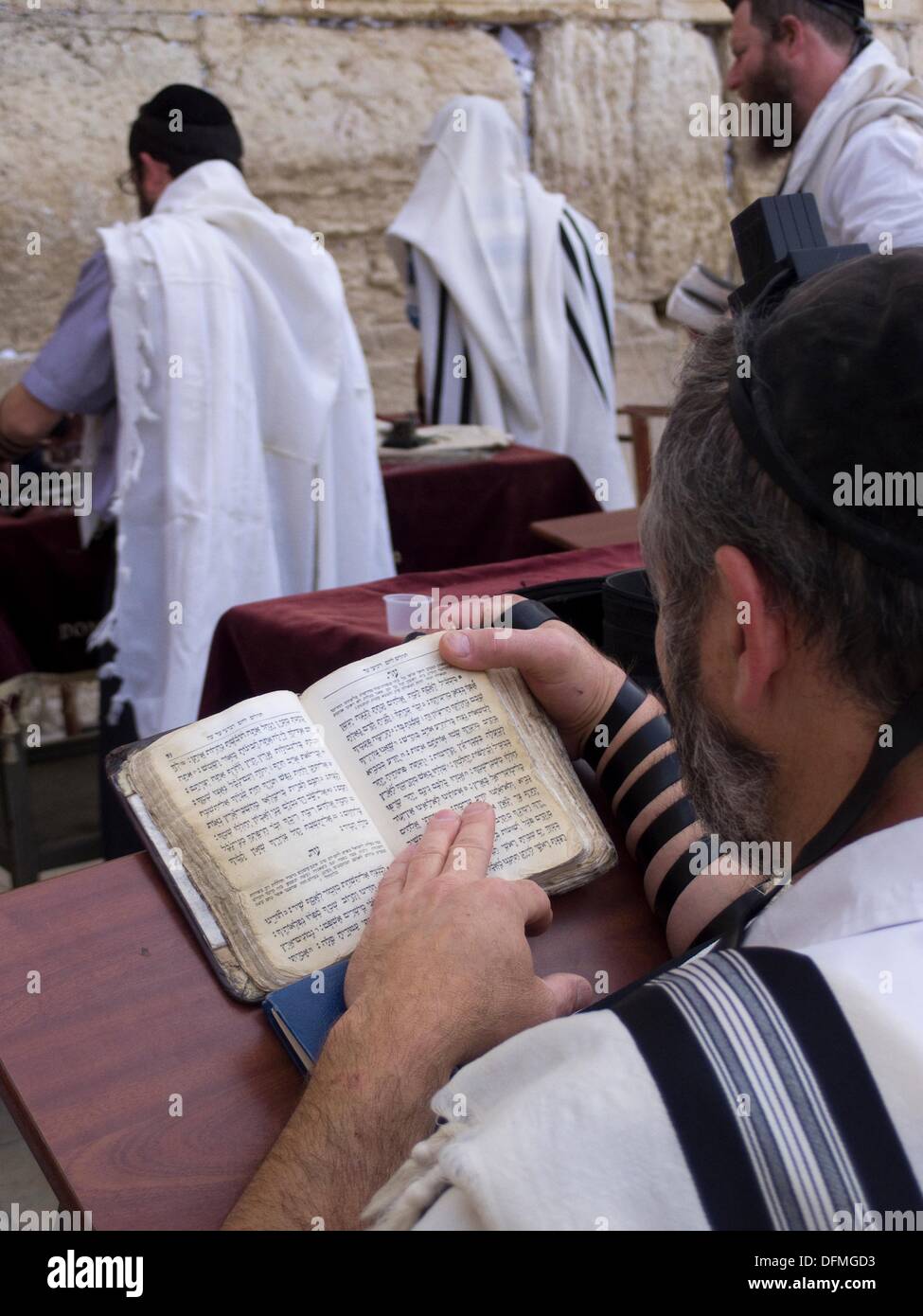 Observant Jews pray at the Western Wall, the holiest shrine in the Jewish faith in Jerusalem, Israel Stock Photo