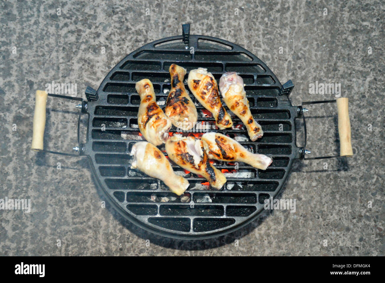 chicken legs cooking on a bbq Stock Photo Alamy