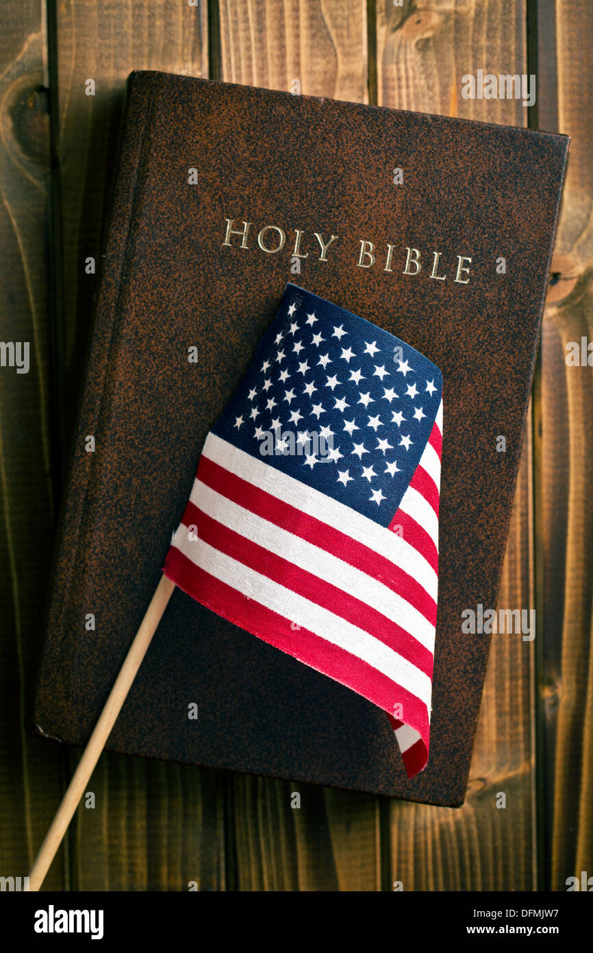 holy bible with american flag on wooden background Stock Photo Alamy