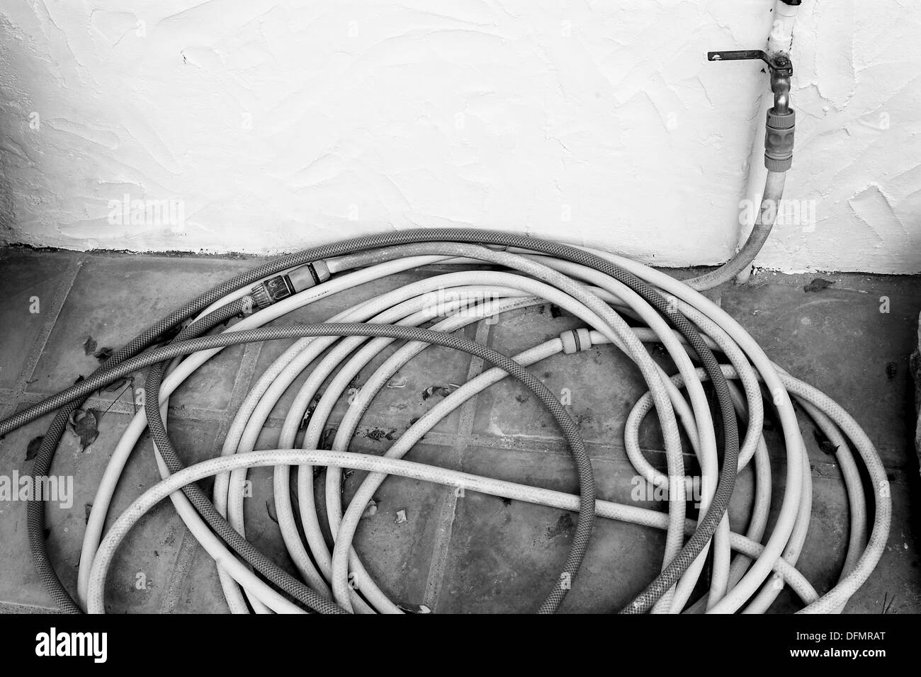 Stopcock and water hose Stock Photo Alamy