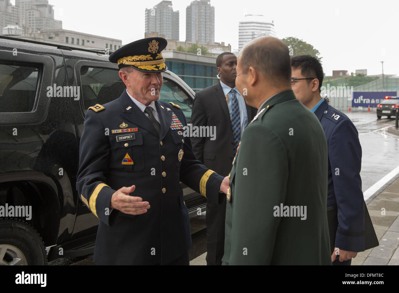 Chairman of the Joint Chiefs of Staff Gen. Martin E. Dempsey is greeted by his South Korean counterpart Gen. Jung Seung Jo during an office call in Seoul, South Korea Sept. 30, 2013. Dempsey is on a four-day trip to South Korea highlighting the strong all Stock Photo