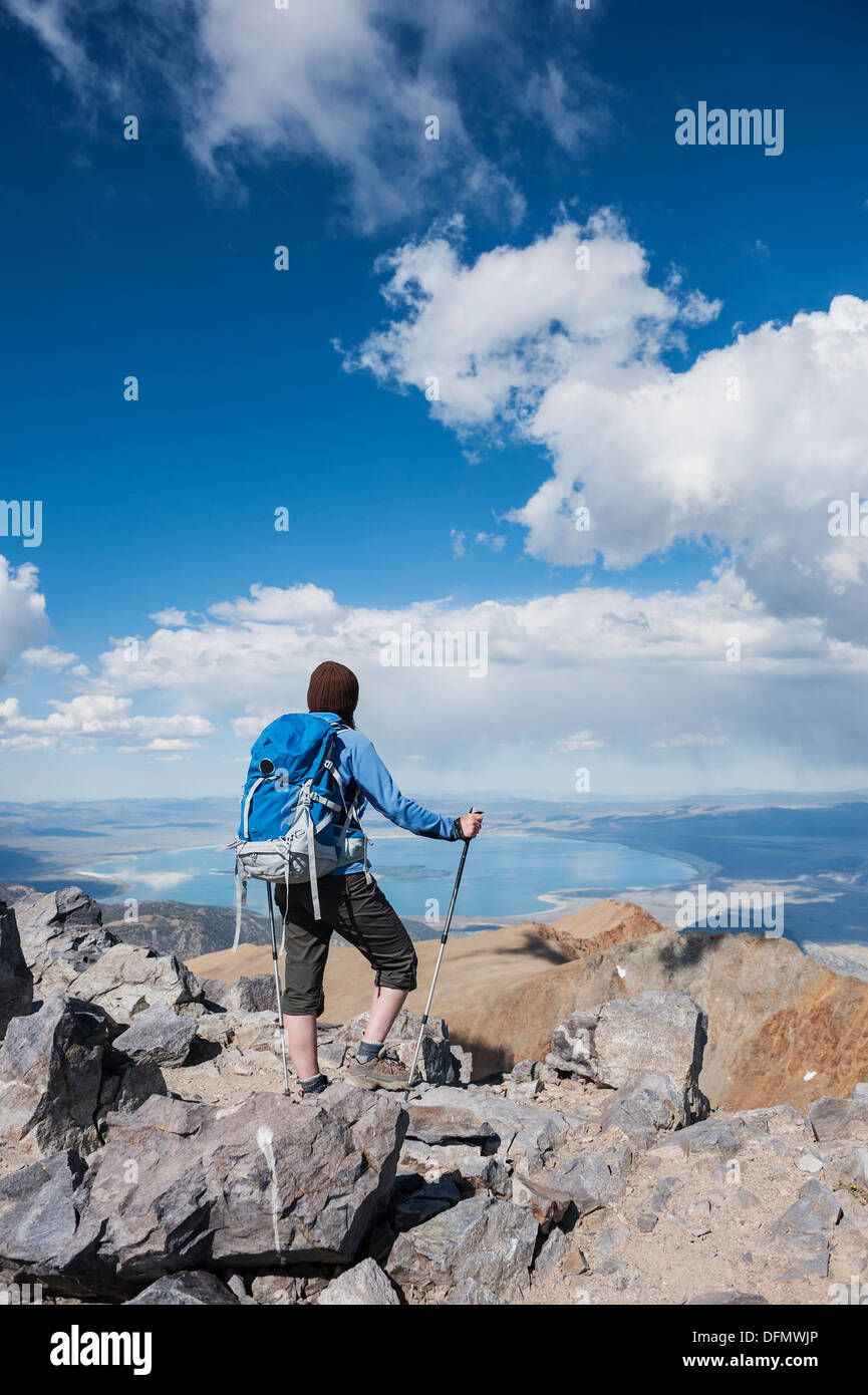 Female hiker takes in view over Mono basin from summit of Mt. Dana (13,053 ft), Yosemite national park, California, USA Stock Photo